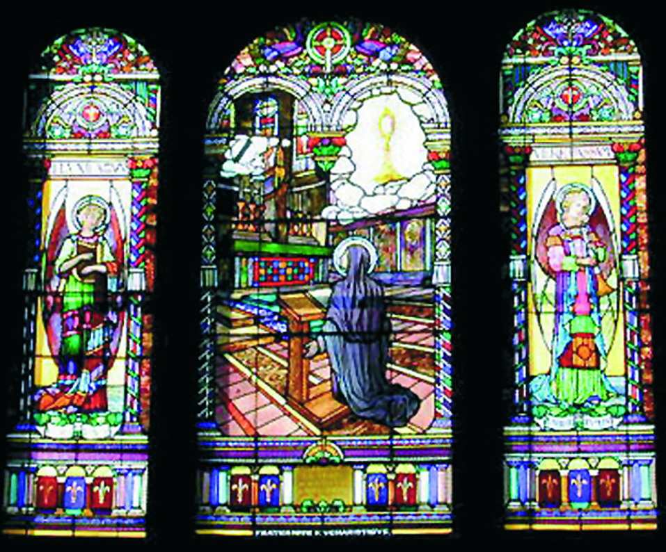 Stained glass window depicting the vision of Saint Juliana vision) issued a papal bull extending the celebration to the universal Church. He also