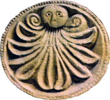 Sculpted mask on the door of
